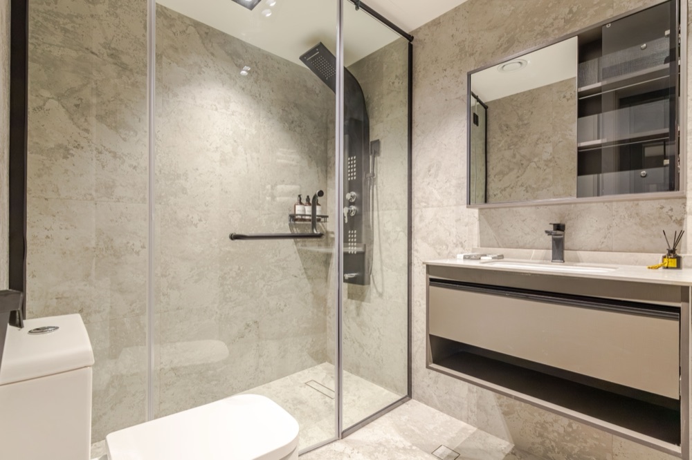 Marble bathroom with smart shower column and LED-edge mirror