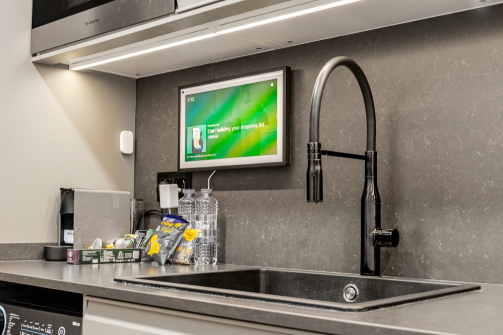 Alexa Echo Show 15 above the sink of an Erbacci residence kitchen